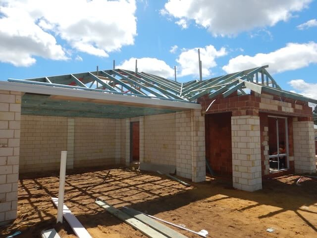 Registered Perth building inspector assessing house under construction 