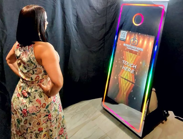a woman standing in front of a mirror Photo Booth