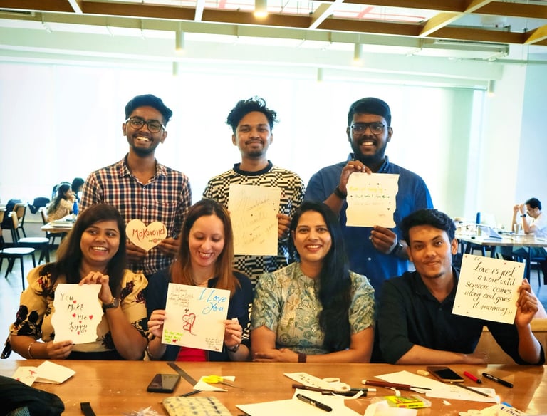 a group of employees holding up signs that say thank