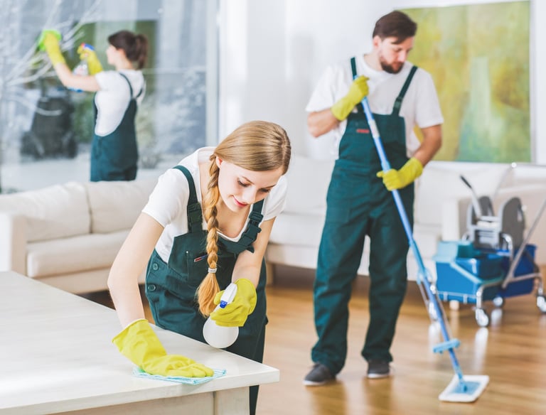 A cluttered room transformed into an organized space by our cleaning experts.