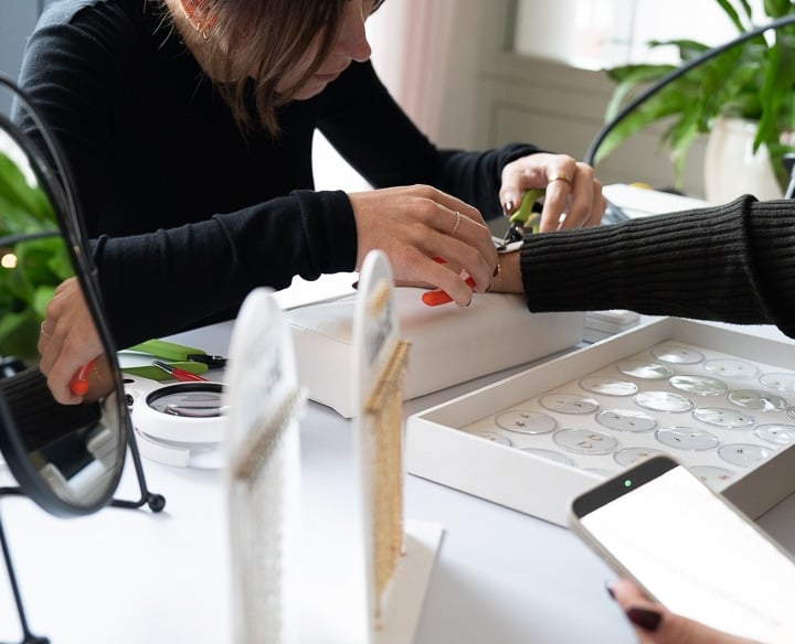 Hands styling products for a brand photoshoot in Brighton and Hove