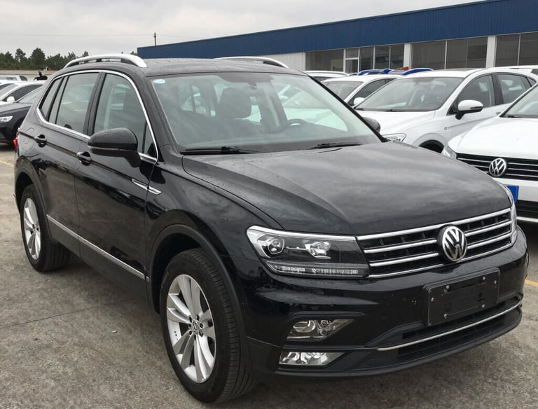 a white car parked in front of a building