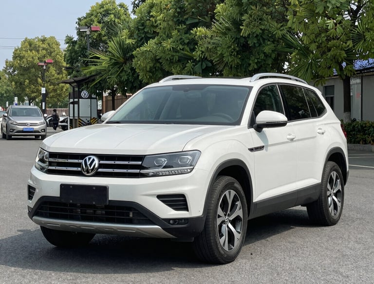 the front of a black car in a garage