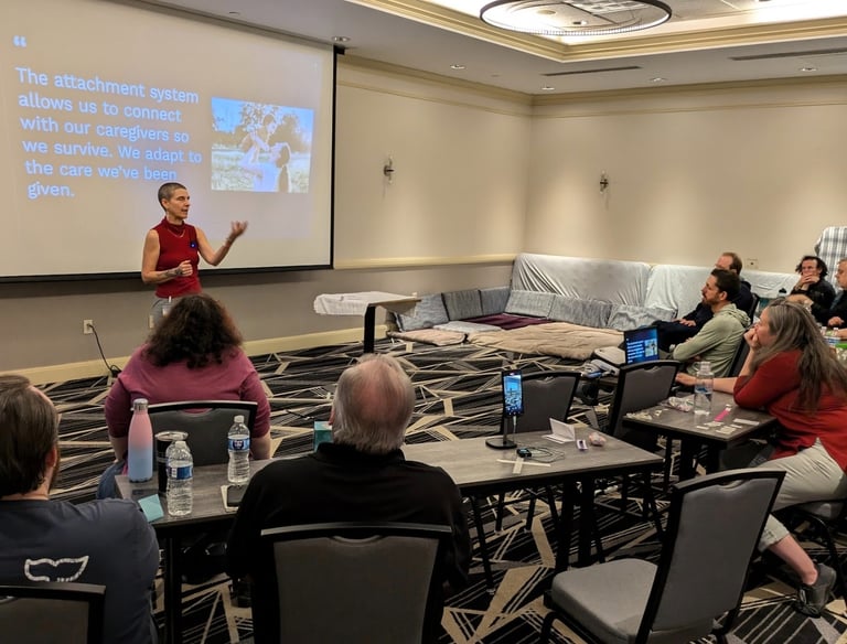 Kassandra speaking at a conference about attachment styles