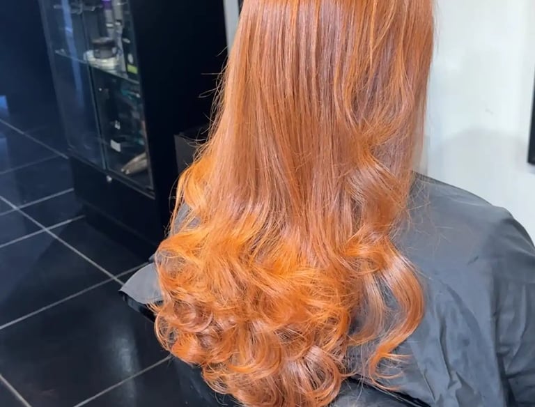 a woman with long red hair and a red hairdoodle