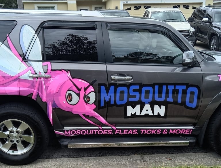 Trained mosquito control technician applying barrier treatment