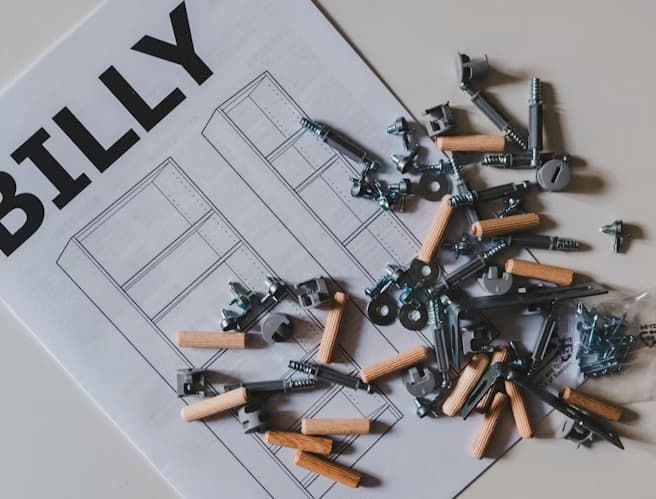 handyman organizing parts to build IKEA furniture