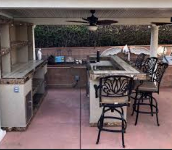 a kitchen with a bar stool and a bar stool