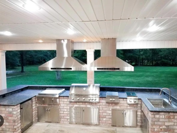 a kitchen with a grill and a grill