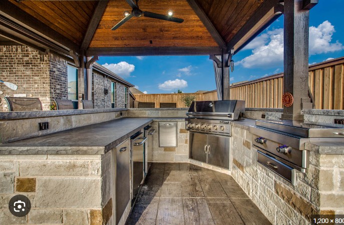 a kitchen with a ceiling fan and a ceiling fan