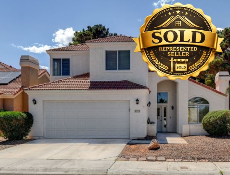 a sold sign that says sold in the foreground