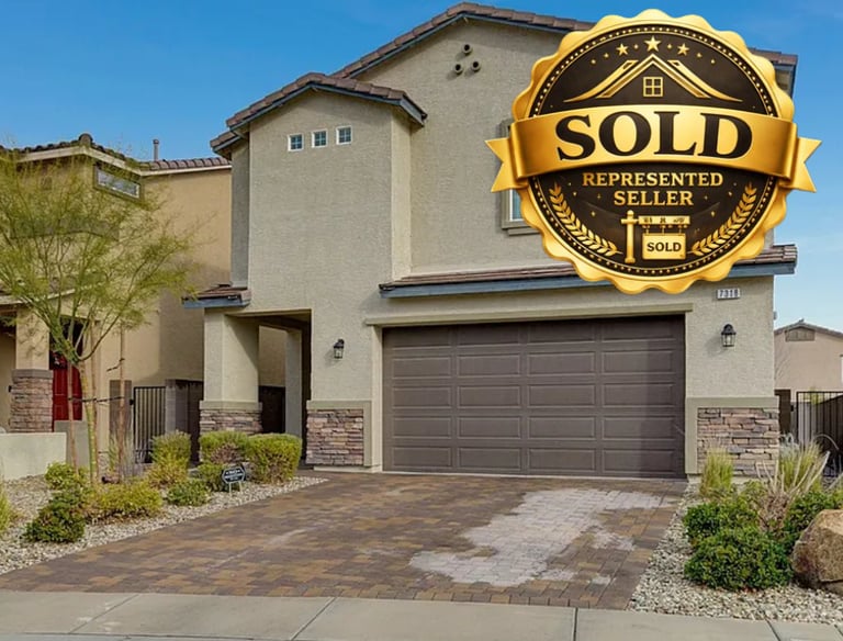 a home with a sold sign on the front of a house