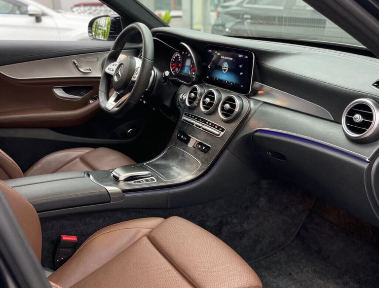 Close-up of premium detailing products and tools arranged neatly on a clean surface.