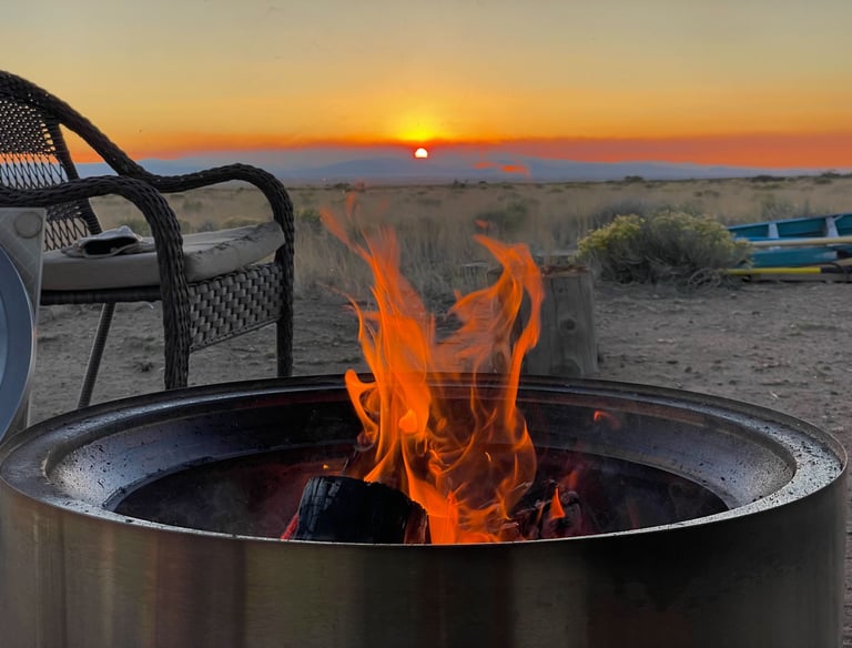 a fire pit with a fire in the middle of it