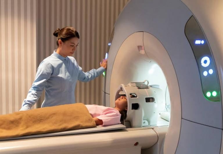 Medical staff assisting patient before MRI scan at Delhi diagnostic center.