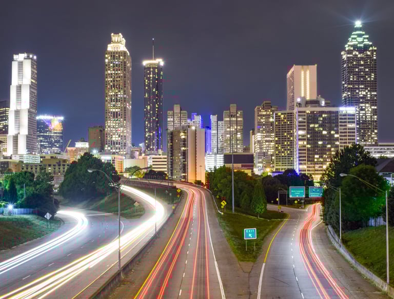 a city skyline with a highway and a city skyline
