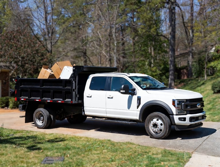 2024 Ford F-550 high side dump truck parked in a clean suburban driveway in Fredericksburg, Virginia