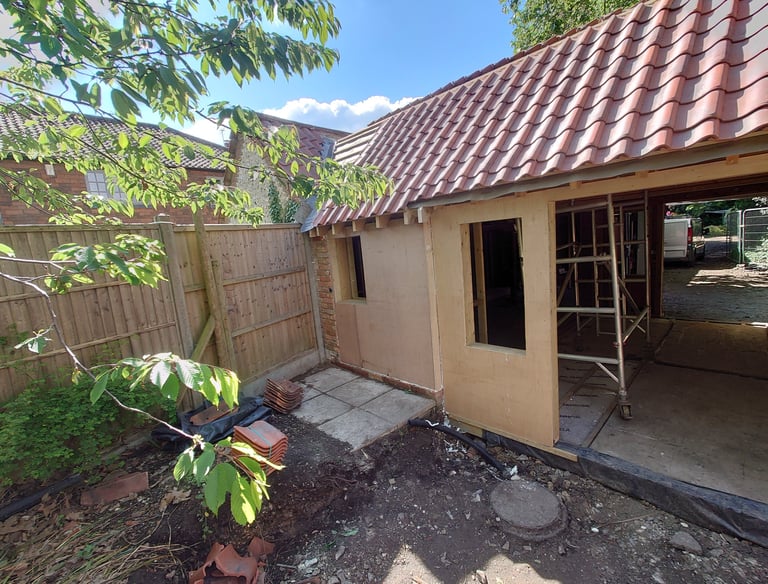 a house with a red tile roof and a red tile roof