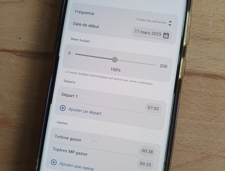 a phone with a phone showing the program on the screen