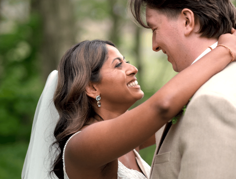 A bride and groom embracing
