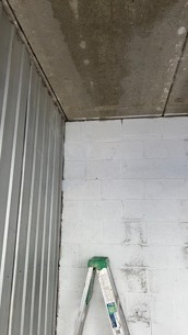 new brick repair on storage facility wall