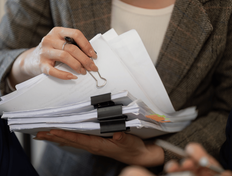 a woman holding a clipboard, clinical documents