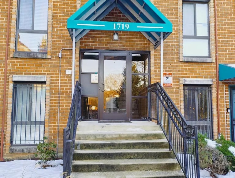 Front entrance of the brick building at Apartment for Rent Anacostia DC, 1719 Gainesville St SE.