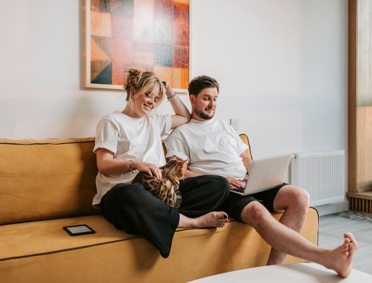 a man and woman sitting on a couch