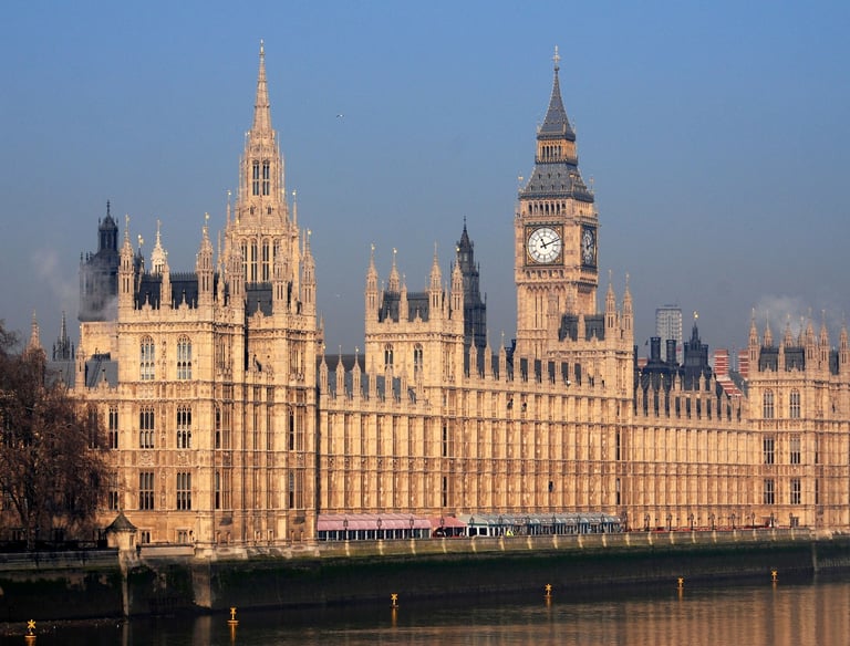a large building with a clock tower in the background