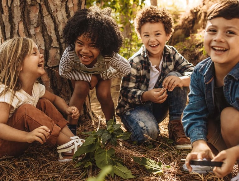 a group of children playing and smiling