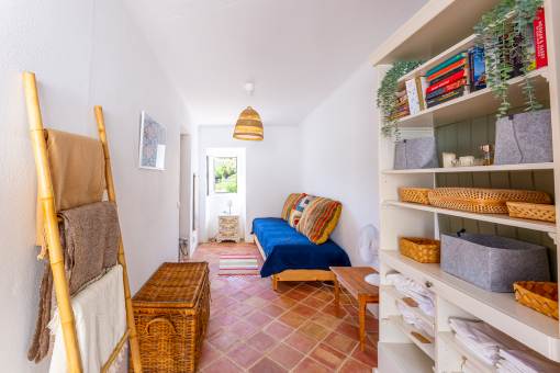 a room with a couch and a ladder