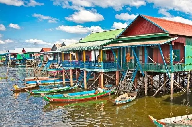 a group of boats docked at a pier