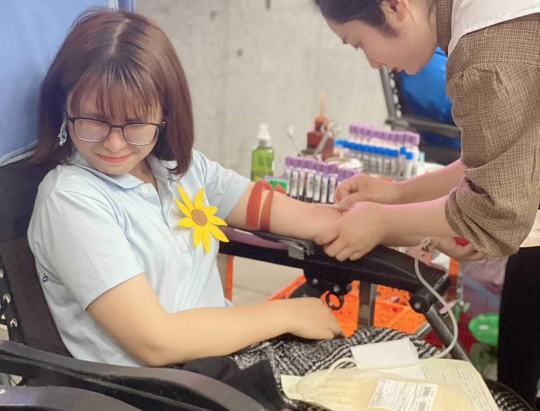 a girl is donating blood