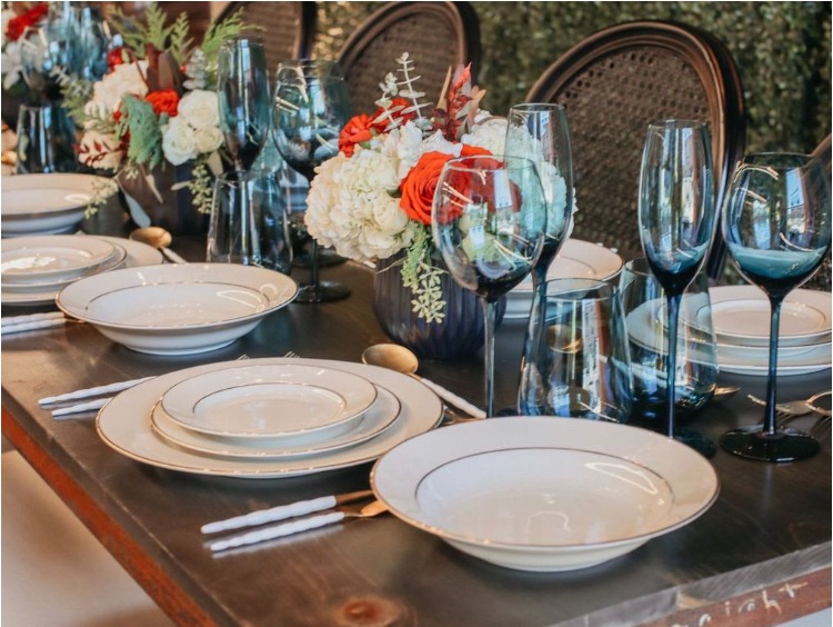 a table setting with a table setting for a dinner paryt planner.