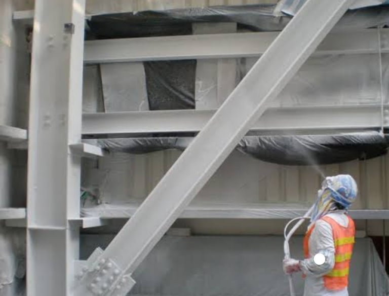 Intumescent painter applying fire proof coating. Intumescent paint applicator