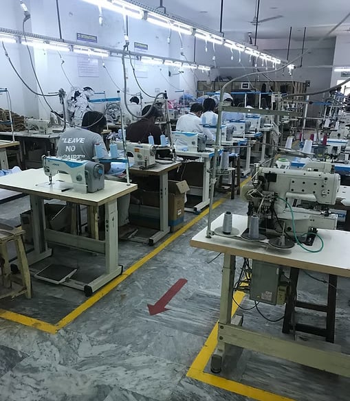 Advanced automated machinery producing high-performance tactical uniforms.