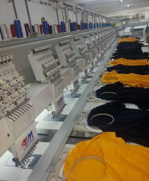 Technician operating embroidery machines for custom tactical patches at Zestlet.