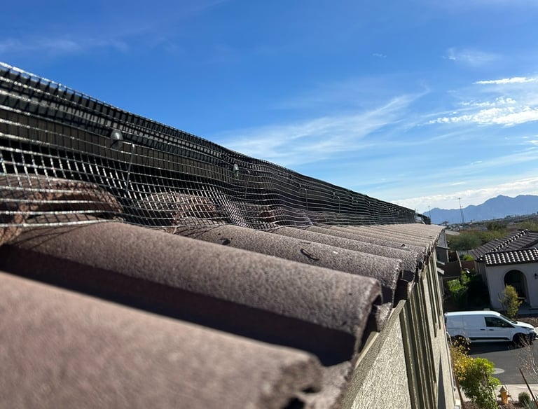 closeup of pigeon proof mesh installed on solar panels fastened with j-hooks in phoenix arizona