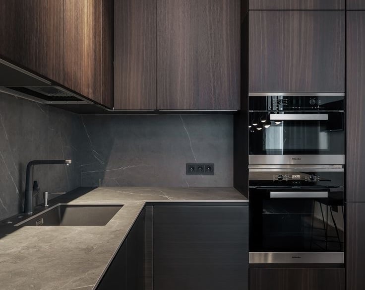 a kitchen with a wooden floor and a sink