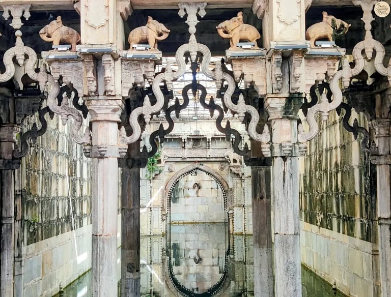 Ornate arches reflecting in the still waters of Rani Ji Ki Baori, Bundi — a mesmerizing play of stone and silence.