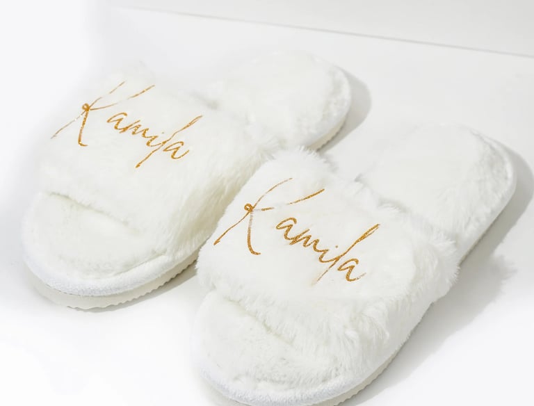 a pair of slippers with the words,'kanra'written on them