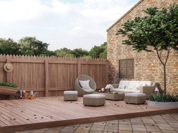 a patio with a wooden decking area and a wooden deck