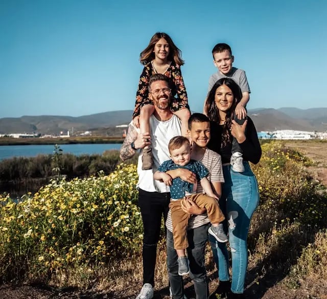 large young Caucasian family in a prarie