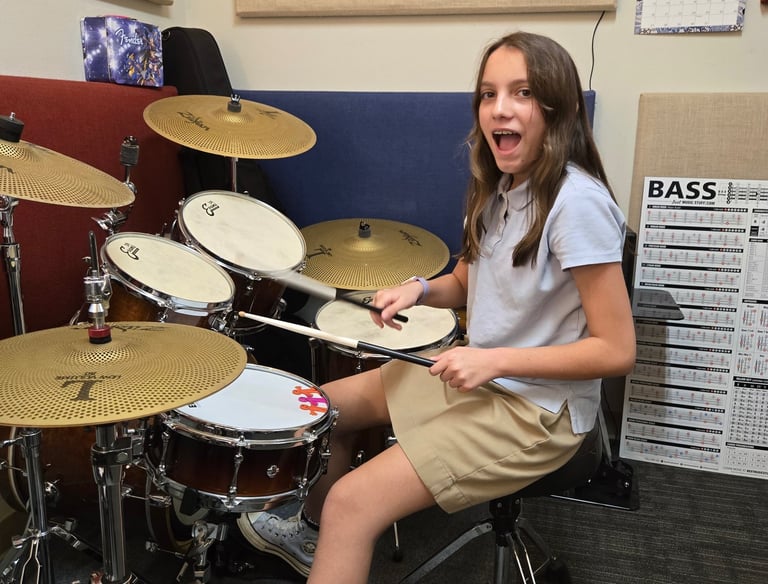 Teenager enjoying drum lessons