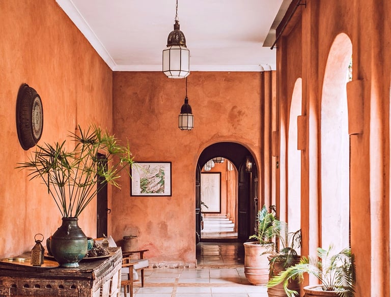 a welcome hallway with a large rug and a wooden table at reception. Guest Experience Enhancement