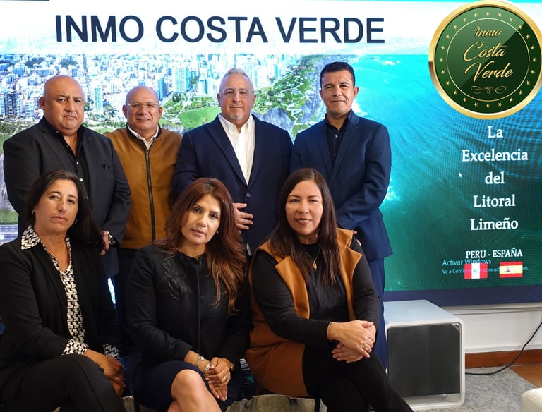 a group of people standing in front of a large screen