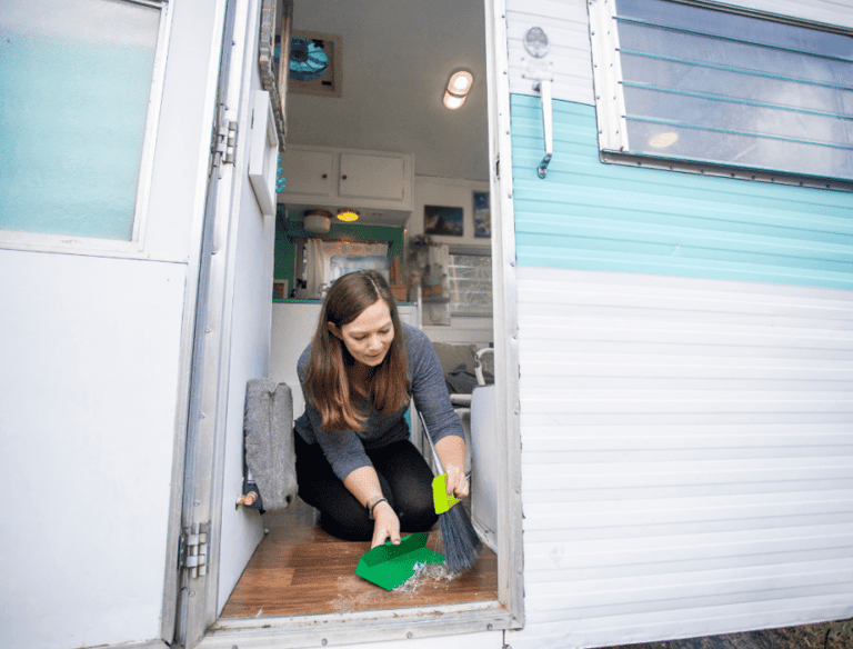 a woman cleaning a camper