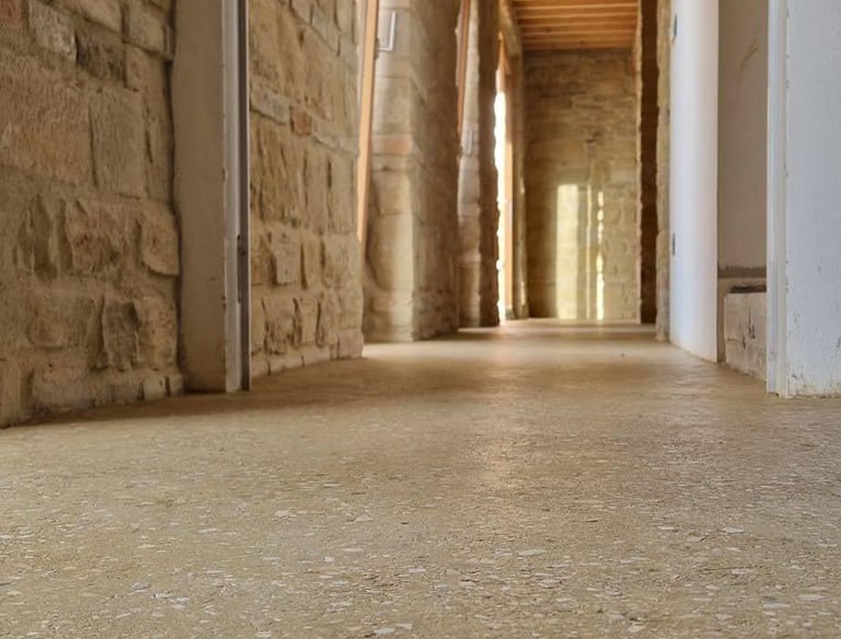 rammed earth floor of a stone house