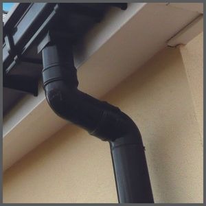 Roofing Specialist Yorkshire. Guttering and downpipes on the side of a house.