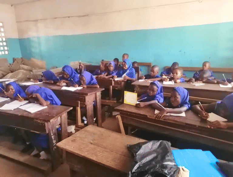A student teaching in a village school supported by Maakitheena – Sierra Leone education and Islamic